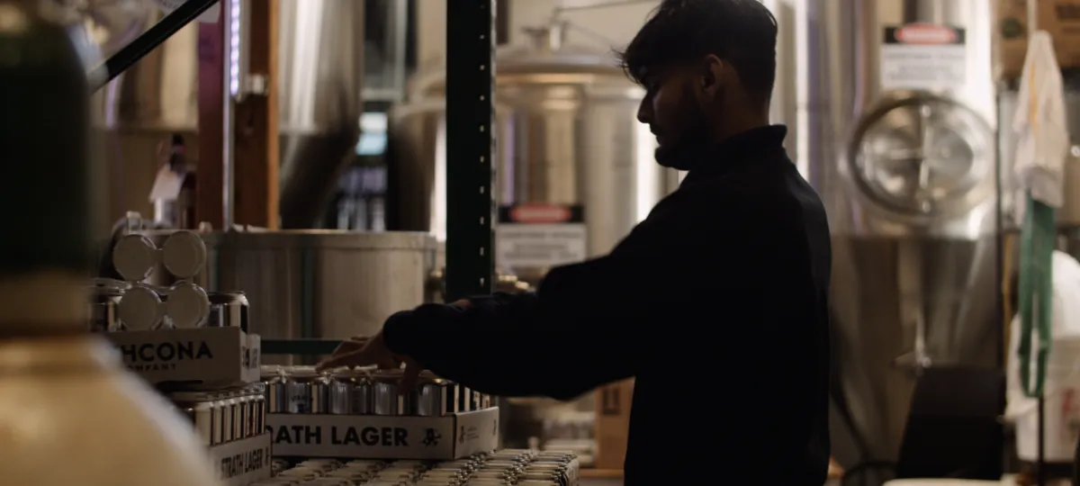 young man working at brewery