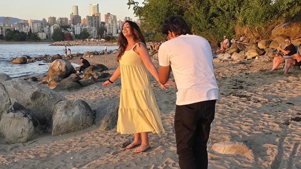 young woman standing on beach near Vancouver